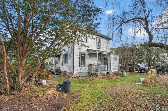 an aerial view of residential houses with city street