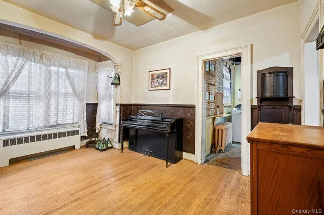 a bed room with a bed and a television