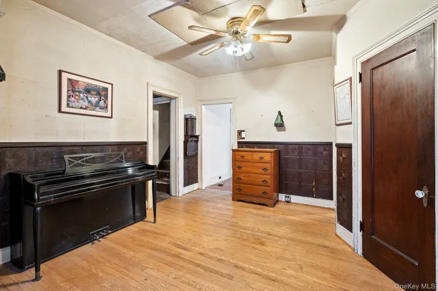 walk in closet with wooden floor