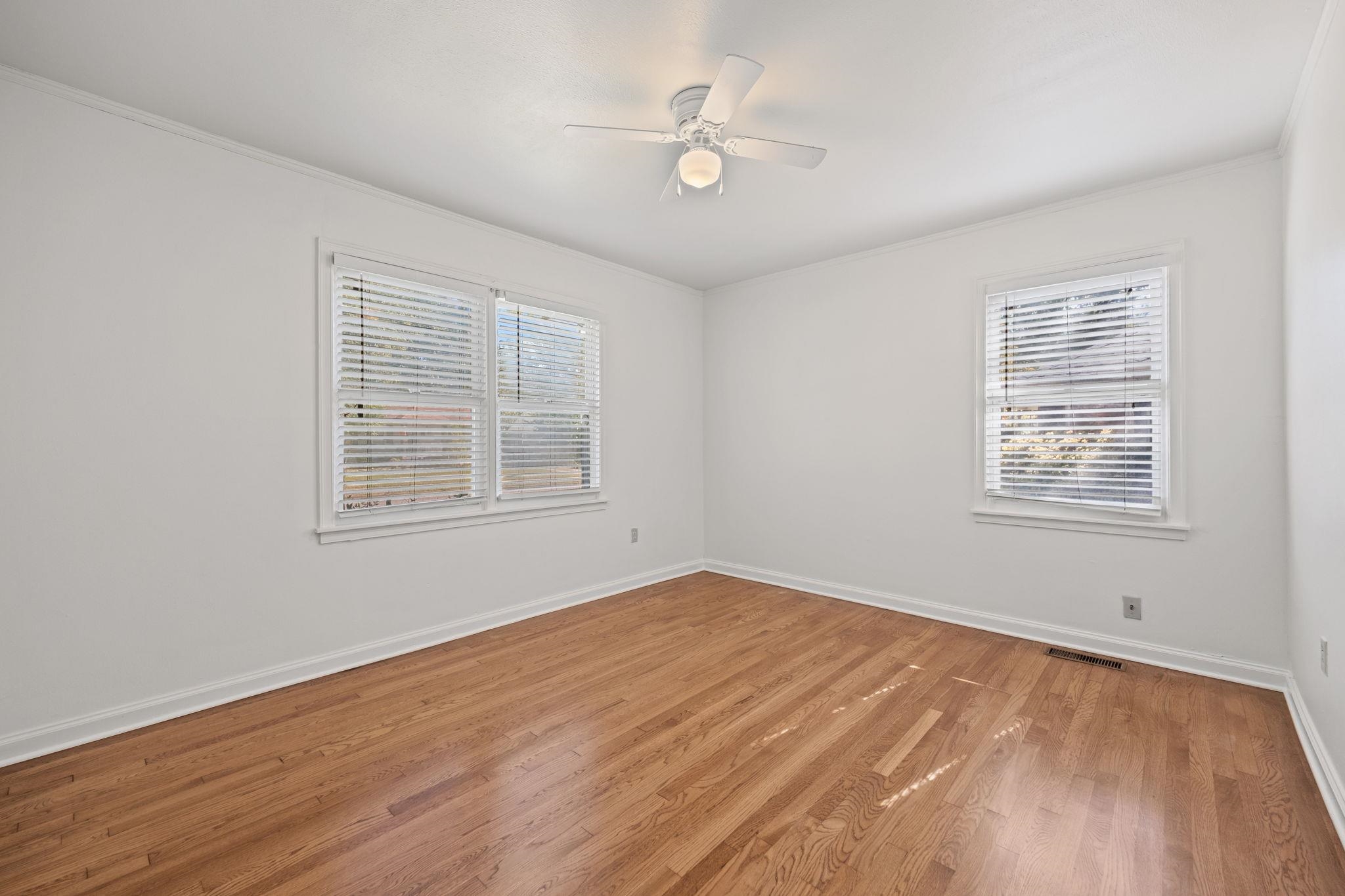 1261 Marcia Road Memphis, TN 38117 - Photo 17 of 27 wooden floor in an empty room with a window