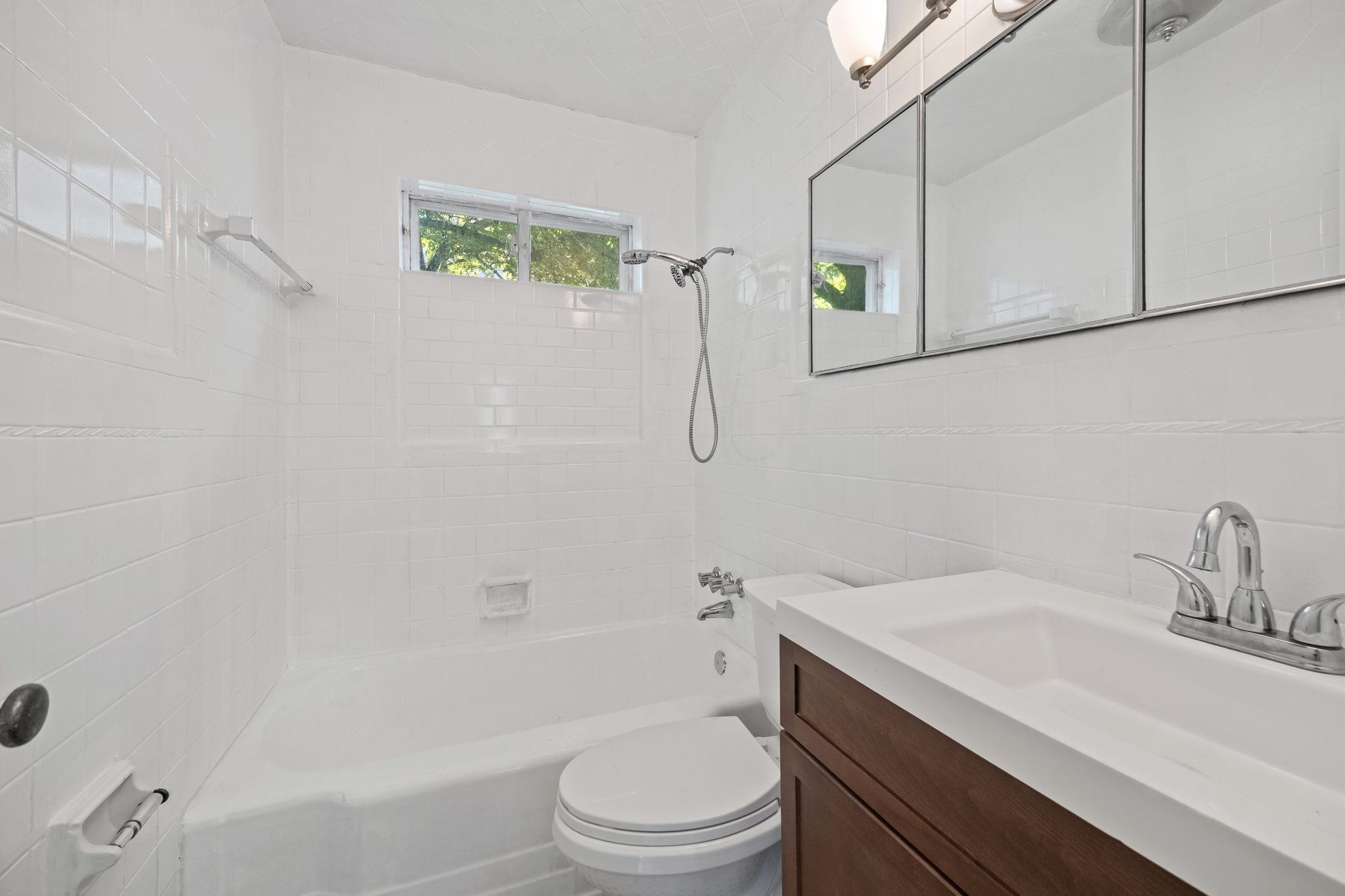 1261 Marcia Road Memphis, TN 38117 - Photo 20 of 27 a bathroom with a sink a toilet and shower