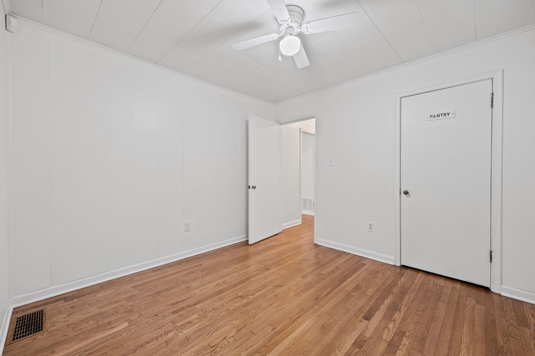 1261 Marcia Road Memphis, TN 38117 - Photo 22 of 27 a view of an empty room with wooden floor
