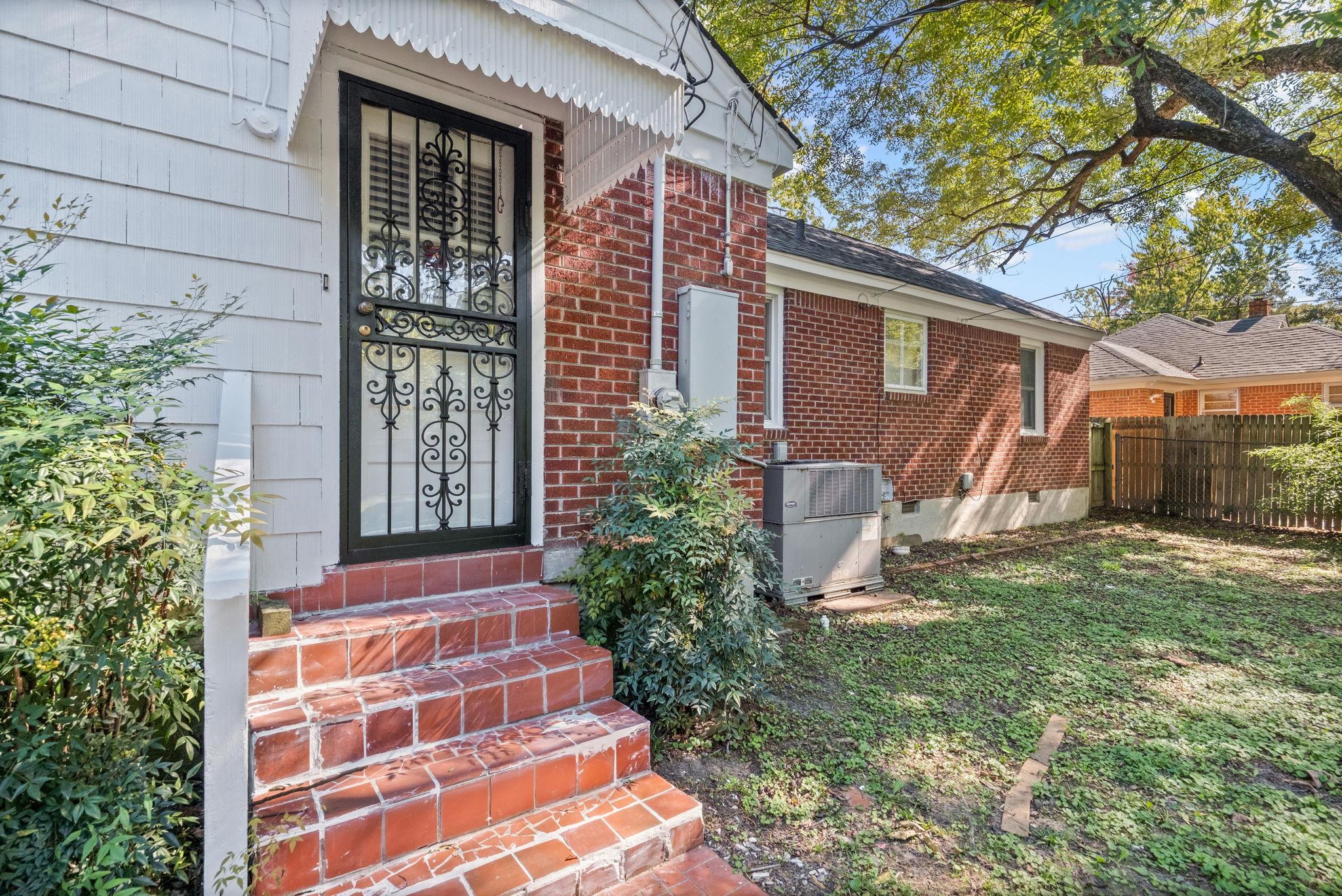 1261 Marcia Road Memphis, TN 38117 - Photo 23 of 27 a front view of a house with garden