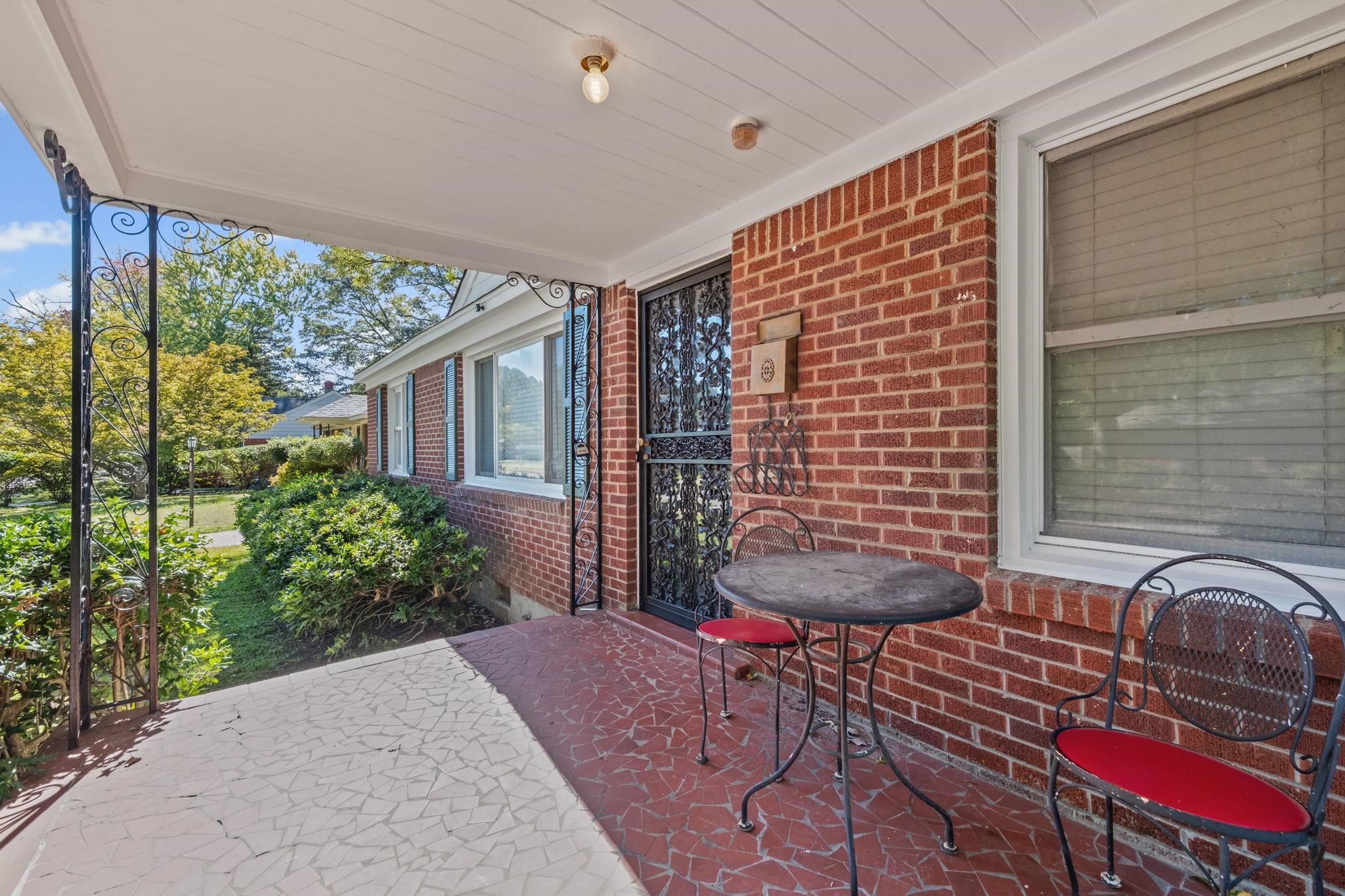1261 Marcia Road Memphis, TN 38117 - Photo 4 of 27 a front view of a house with outdoor seating