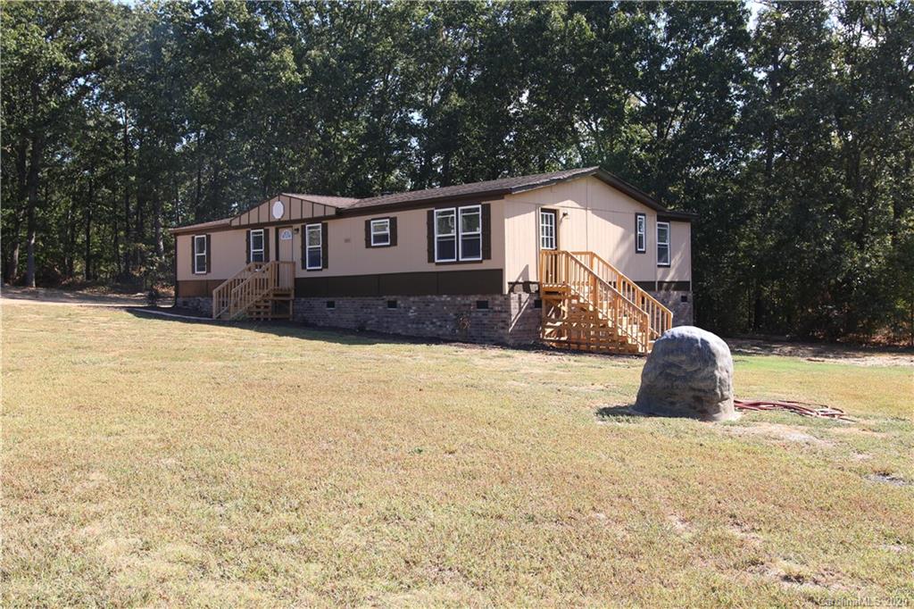 6710 Santa Claus Road Monroe, NC 28110 - Photo 3 of 30 a house view with a outdoor space