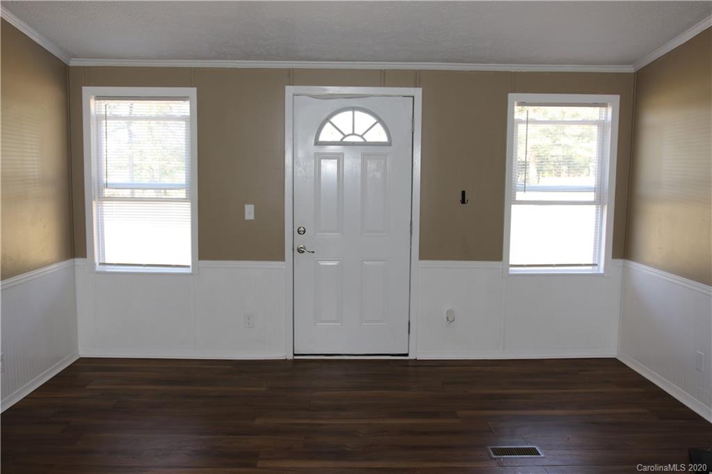 6710 Santa Claus Road Monroe, NC 28110 - Photo 22 of 30 an empty room with wooden floor and windows