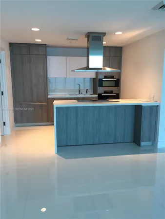 a view of a kitchen with a sink