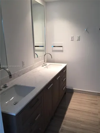 a bathroom with bathtub and shower