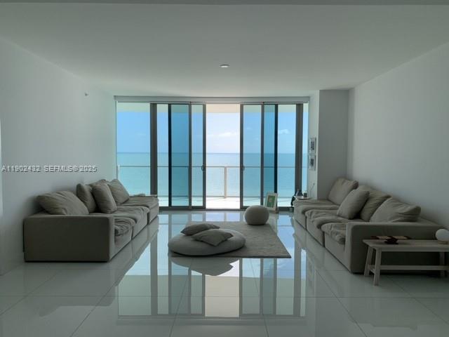 350 Ocean Drive, Unit 704N Key Biscayne, FL 33149 - Photo 10 of 34 a living room with furniture and a large window
