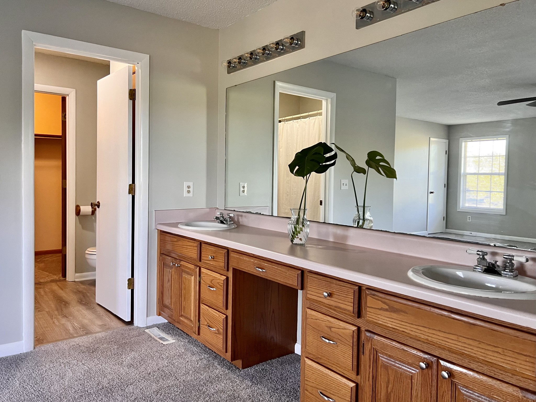 1005 West Point Road Lawrenceburg, TN 38464 - Photo 15 of 28 a bathroom with double vanity sinks and a mirror