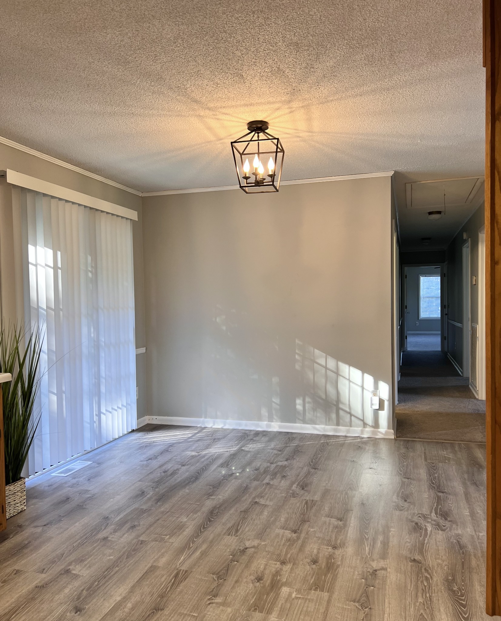 1005 West Point Road Lawrenceburg, TN 38464 - Photo 10 of 28 a view of an empty room with wooden floor and a window