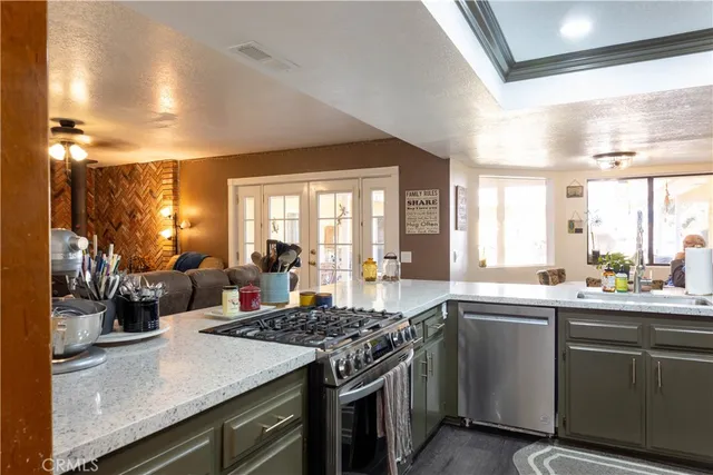 a kitchen with a sink stove and cabinets