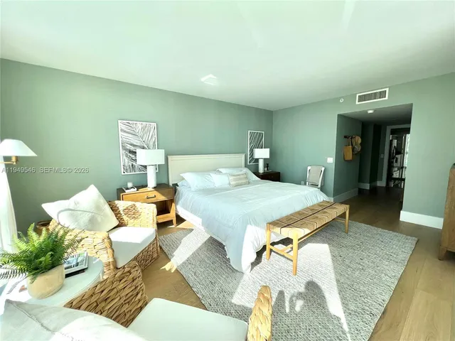 a bedroom with a bed and a table