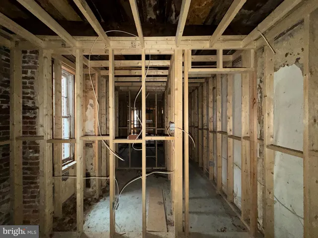 a view of an empty room with wooden walls