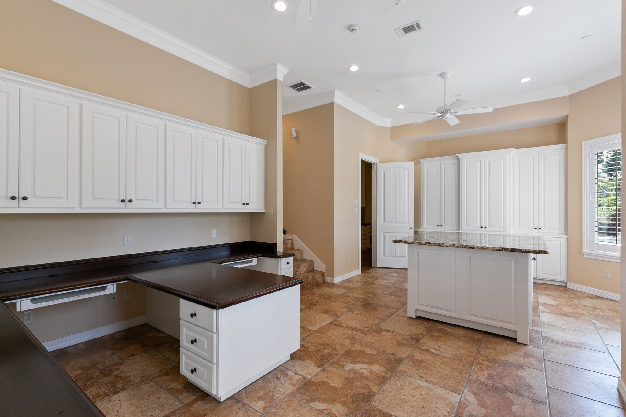 17018 Grant Road Cypress, TX 77429 - Photo 5 of 50 a kitchen with granite countertop white cabinets and stainless steel appliances