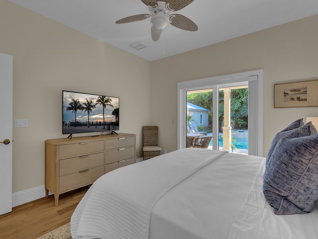 548 Conn Way Vero Beach, FL 32963 - Photo 15 of 35 a bedroom with a bed and a flat screen tv