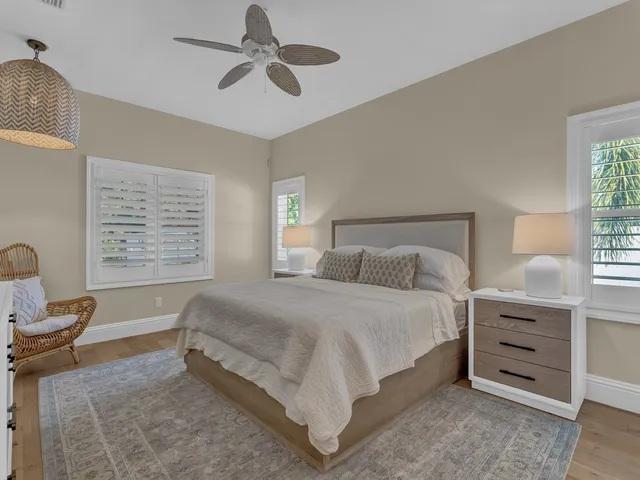 a bed room with a bed and a chair