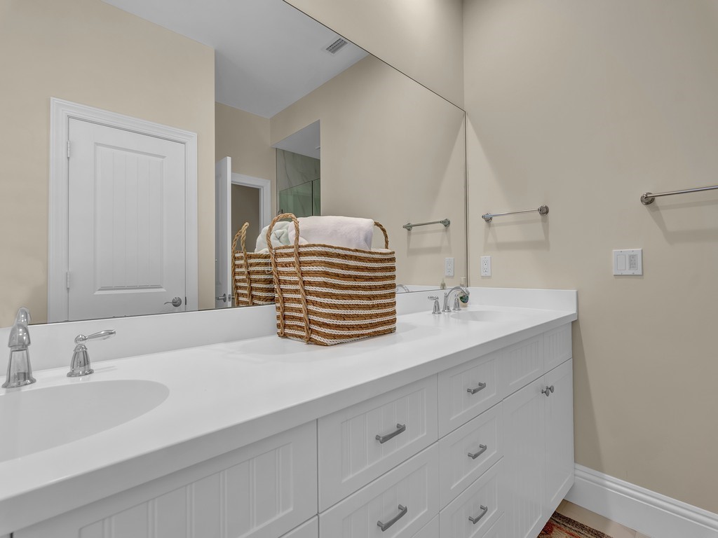 548 Conn Way Vero Beach, FL 32963 - Photo 19 of 35 a bathroom with a sink and a mirror