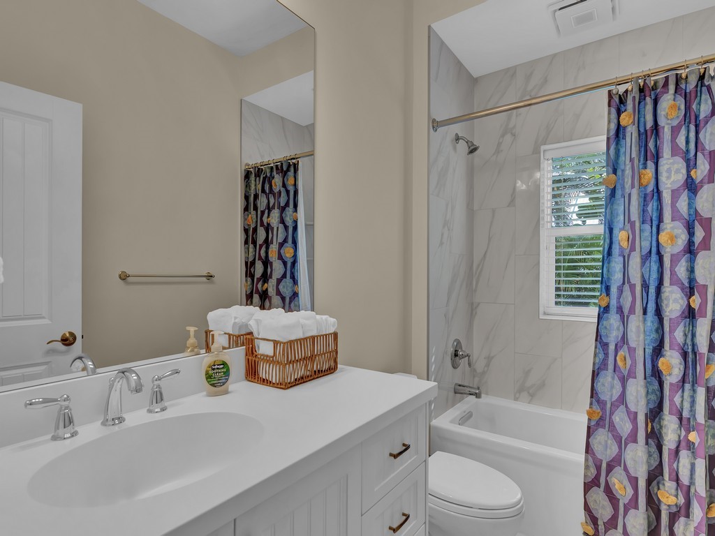 548 Conn Way Vero Beach, FL 32963 - Photo 22 of 35 a bathroom with a sink a toilet and shower