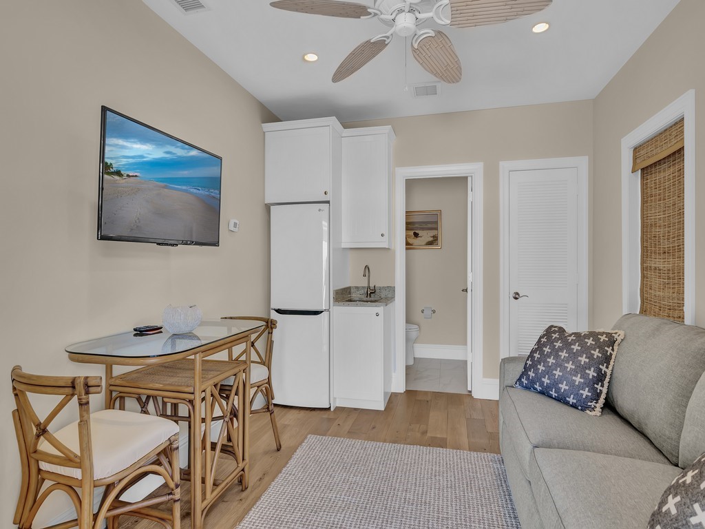 548 Conn Way Vero Beach, FL 32963 - Photo 23 of 35 a living room with furniture and a chandelier
