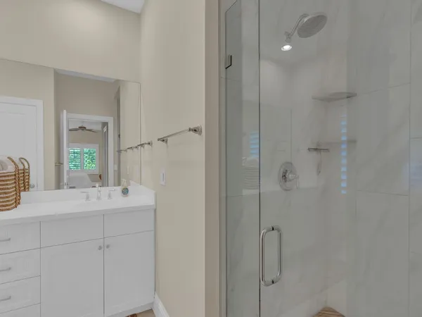 a bathroom with a sink vanity granite tub and shower