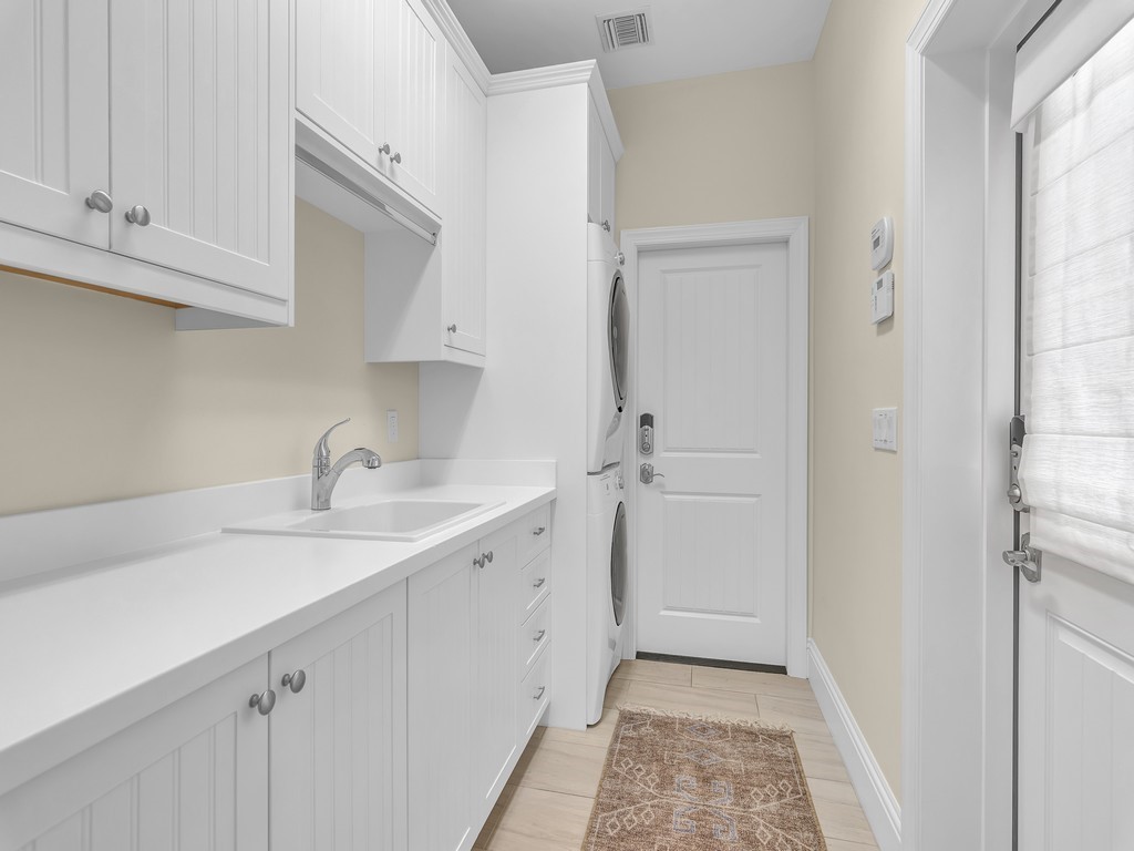 548 Conn Way Vero Beach, FL 32963 - Photo 25 of 35 a kitchen with a sink and cabinets