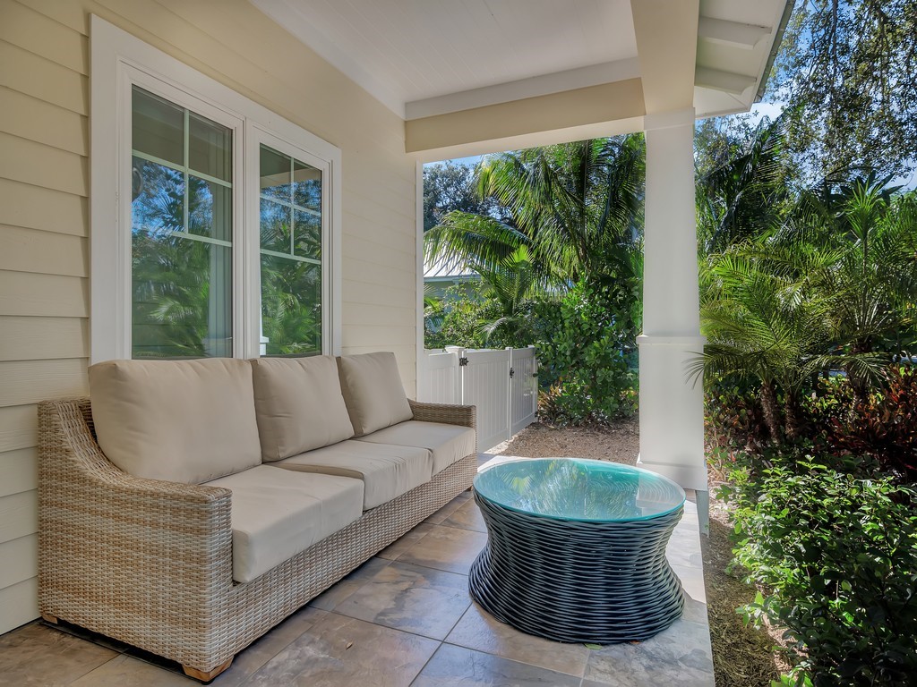 548 Conn Way Vero Beach, FL 32963 - Photo 30 of 35 a living room with a couch and a potted plant