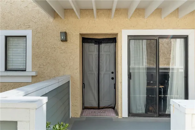 a view of a house with a door and a window