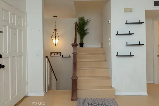 a view of staircase with white walls