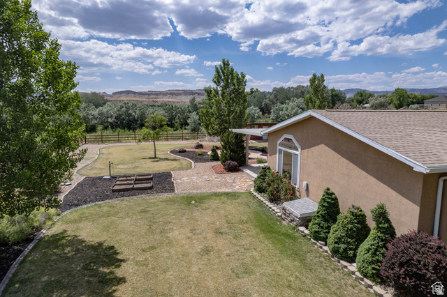 1407 North 1250th Street West Helper, UT 84526 - Photo 25 of 27 Fenced yard with a mountain view