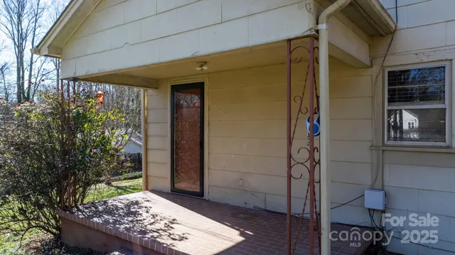 a view of a door and wooden floor