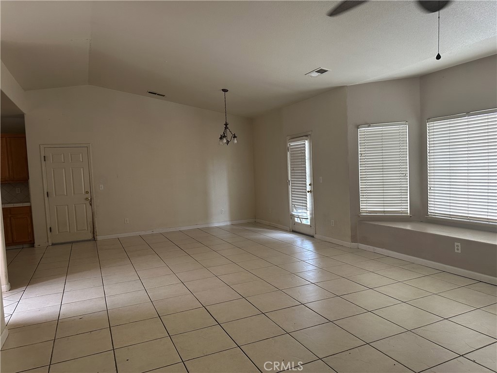 692 Gateway Circle Merced, CA 95340 - Photo 16 of 24 an empty room with windows