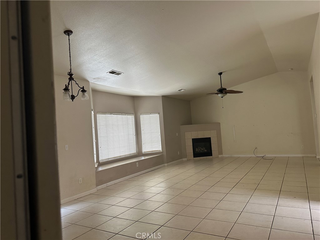 692 Gateway Circle Merced, CA 95340 - Photo 4 of 24 a view of a livingroom with a fireplace and window