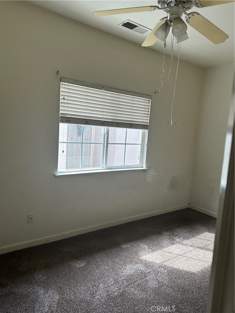 692 Gateway Circle Merced, CA 95340 - Photo 7 of 24 an empty room with a window