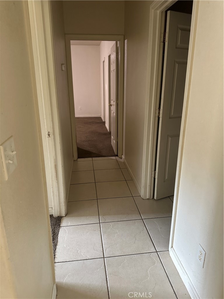 692 Gateway Circle Merced, CA 95340 - Photo 10 of 24 a view of a closet area with living room