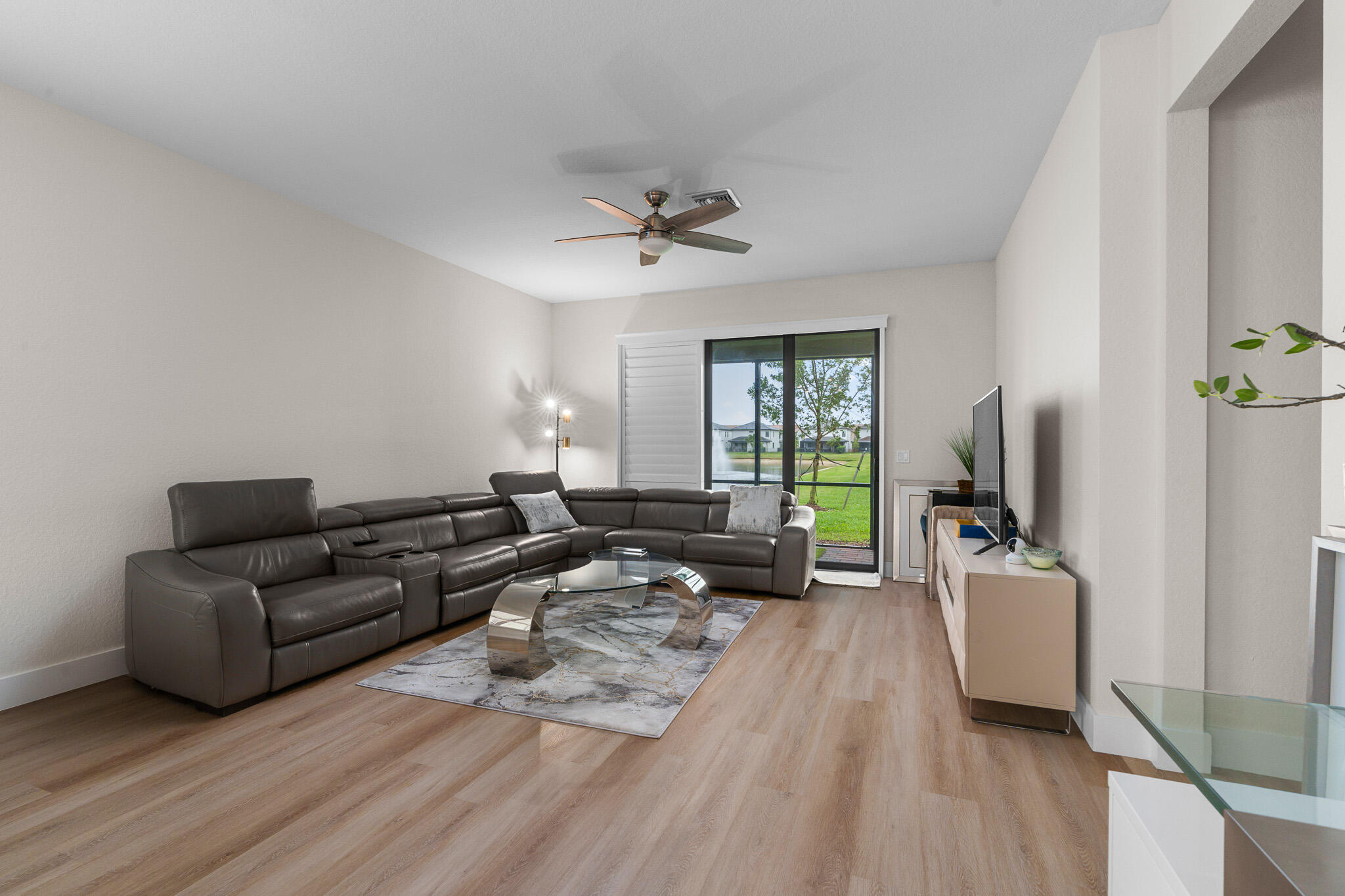 8202 Cadre Noir Road Lake Worth, FL 33467 - Photo 11 of 58 a living room with furniture and a flat screen tv