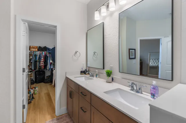 a living room with a large window and a wooden floor