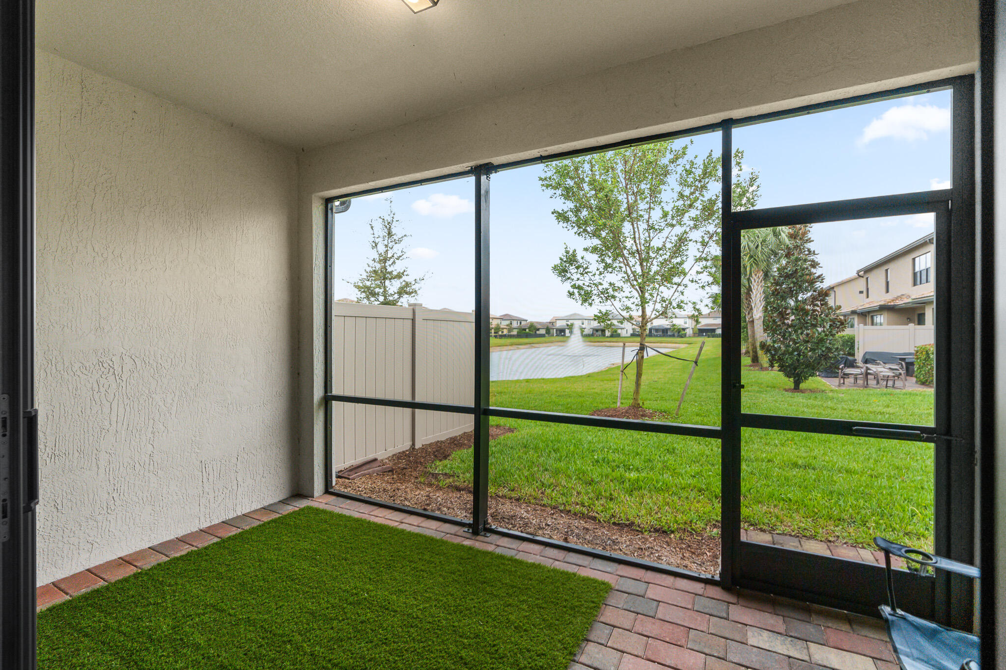 8202 Cadre Noir Road Lake Worth, FL 33467 - Photo 20 of 58 a view of a room with yard from a ceiling fan