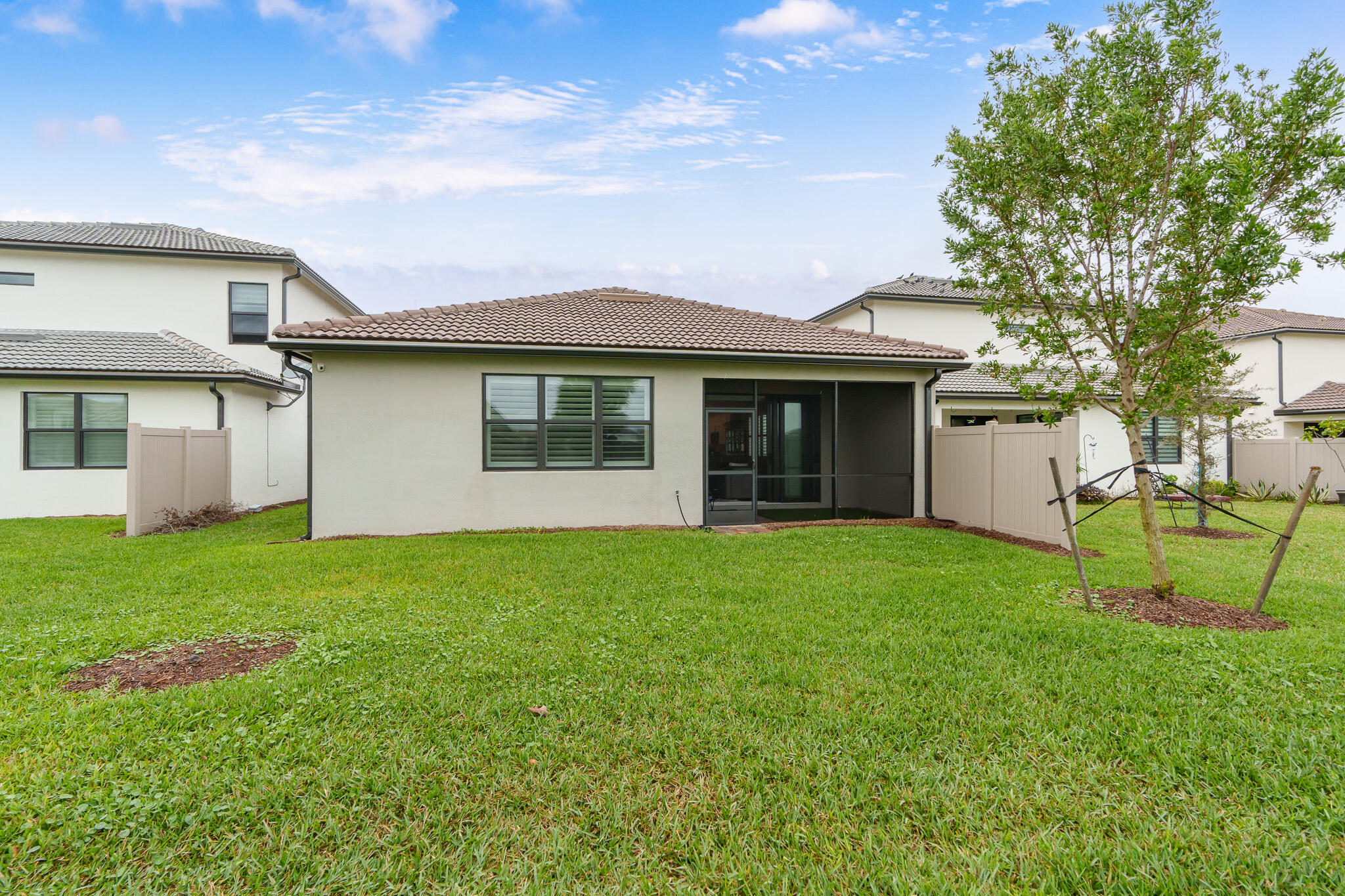 8202 Cadre Noir Road Lake Worth, FL 33467 - Photo 24 of 58 a view of a house with backyard and garden