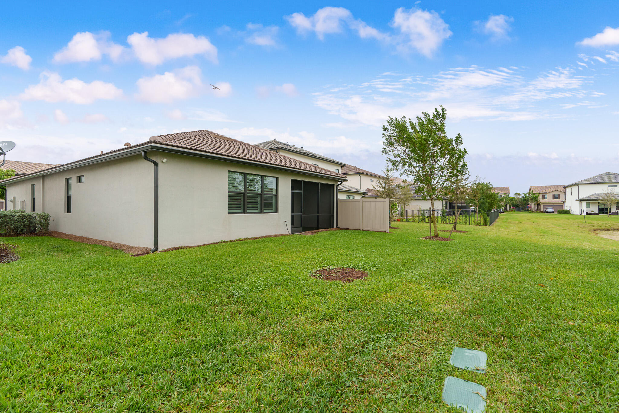 8202 Cadre Noir Road Lake Worth, FL 33467 - Photo 25 of 58 a view of a house with backyard