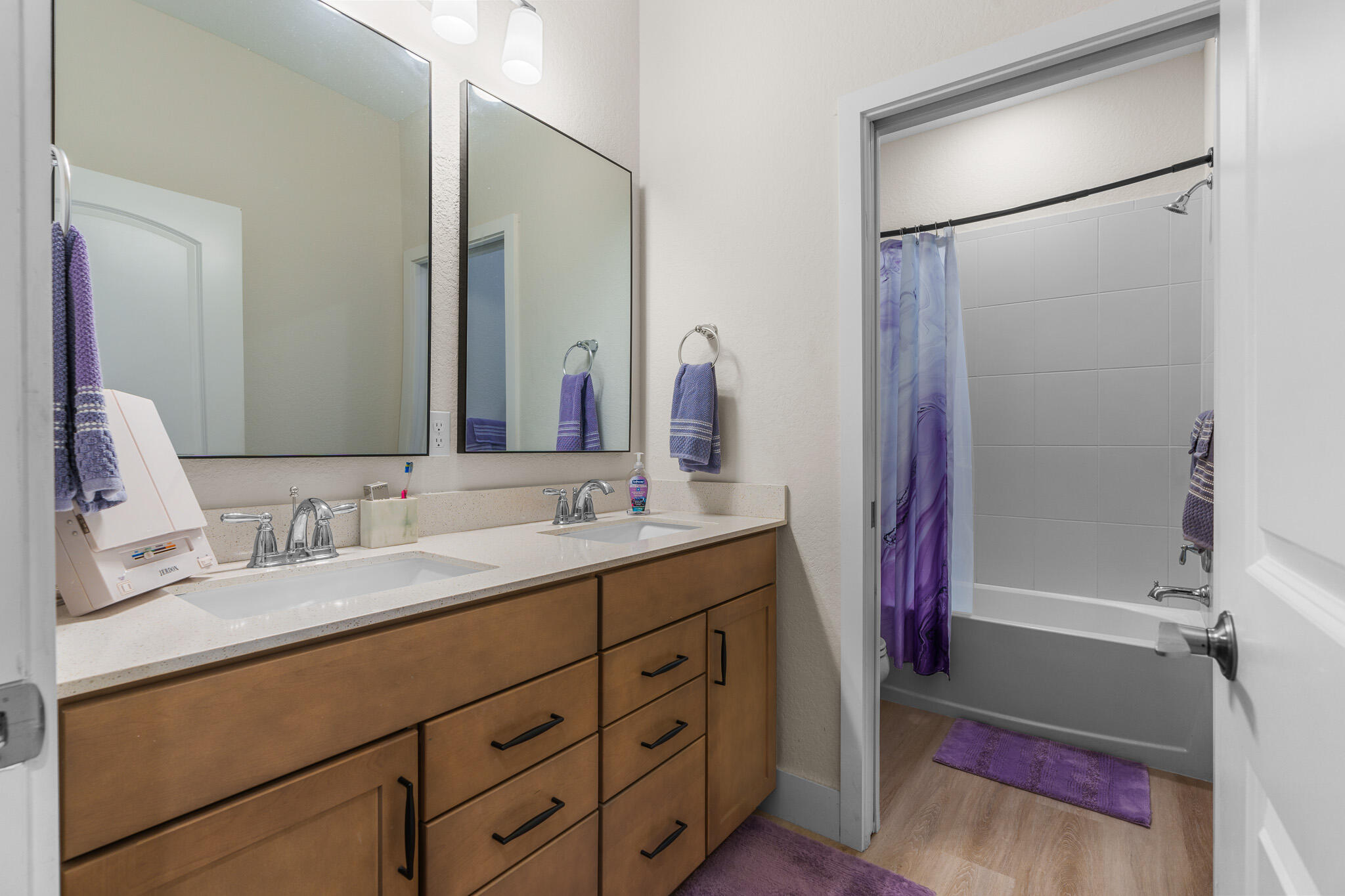 8202 Cadre Noir Road Lake Worth, FL 33467 - Photo 30 of 58 a bathroom with a double vanity sink mirror and shower