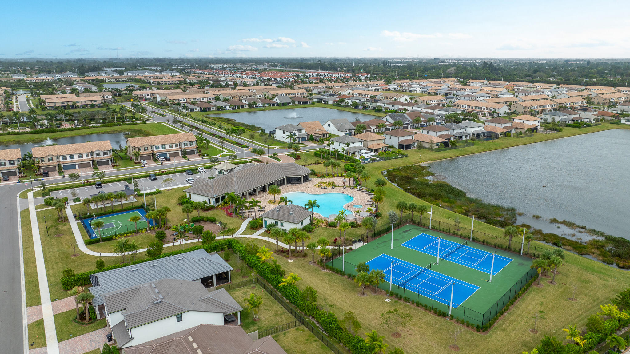 8202 Cadre Noir Road Lake Worth, FL 33467 - Photo 34 of 58 an aerial view of tennis court