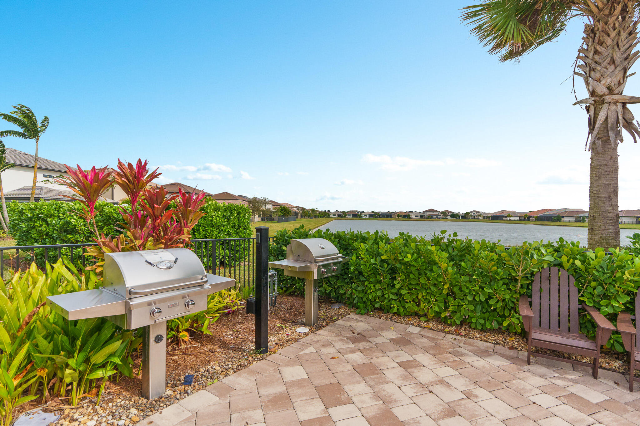 8202 Cadre Noir Road Lake Worth, FL 33467 - Photo 47 of 58 a view of a chairs and table in patio