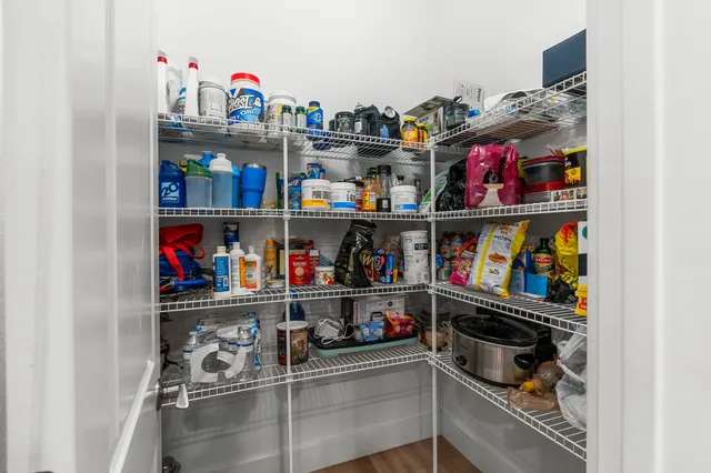 a kitchen with a sink stainless steel appliances and cabinets