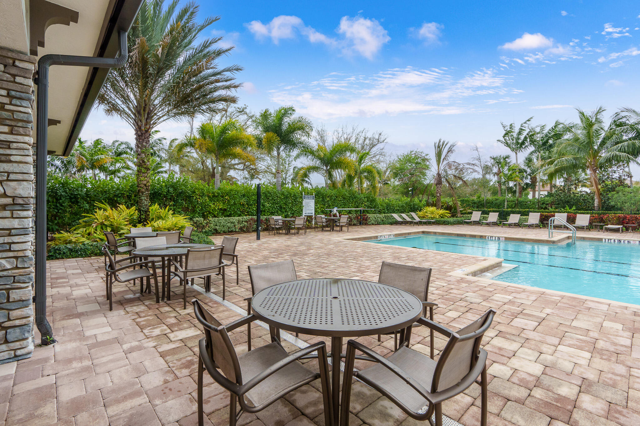 8202 Cadre Noir Road Lake Worth, FL 33467 - Photo 53 of 58 a view of a lake with table and chairs