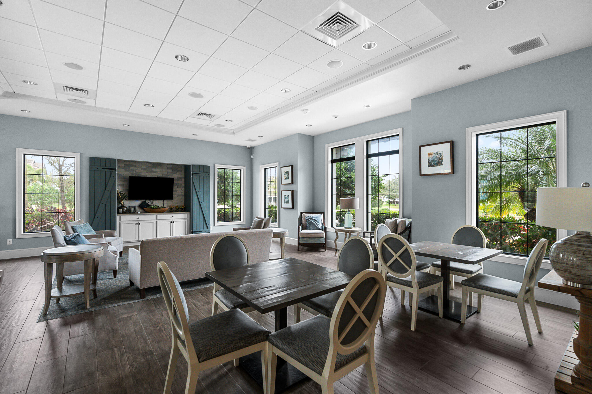 8202 Cadre Noir Road Lake Worth, FL 33467 - Photo 56 of 58 a view of a dining room with furniture window and wooden floor