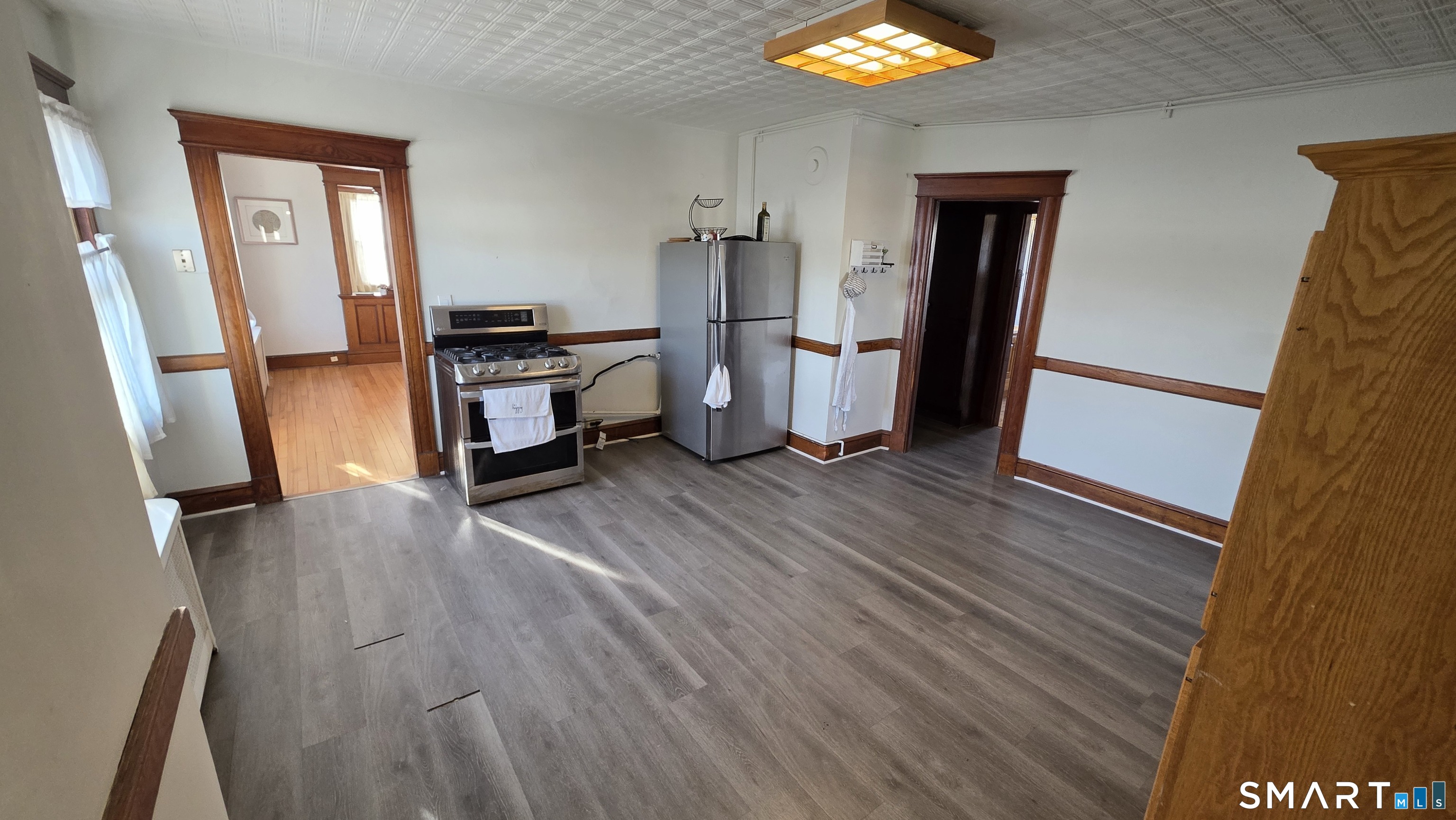 393 Highland Avenue, Unit 3 Waterbury, CT 06708 - Photo 10 of 10 a view of kitchen and hall with wooden floor