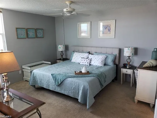 a bedroom with bed and window
