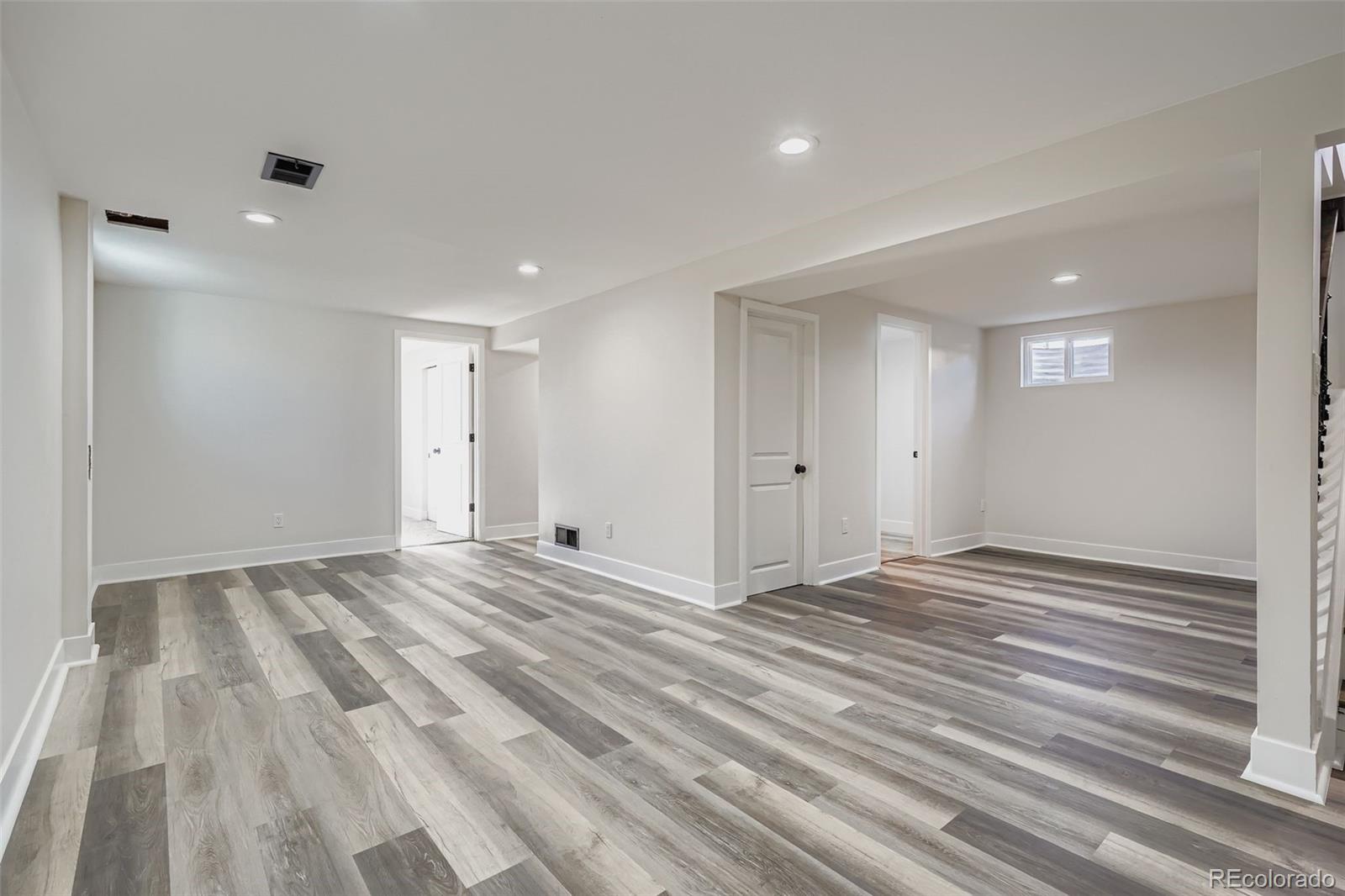 8771 Rutgers Street Westminster, CO 80031 - Photo 15 of 25 a view of empty room with wooden floor
