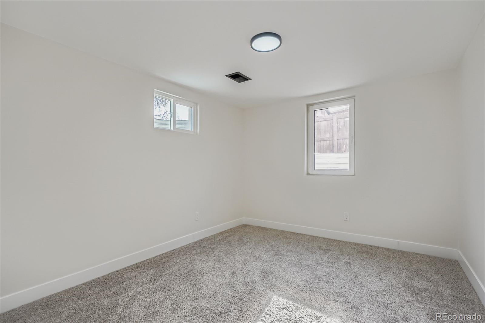 8771 Rutgers Street Westminster, CO 80031 - Photo 17 of 25 an empty room with a window